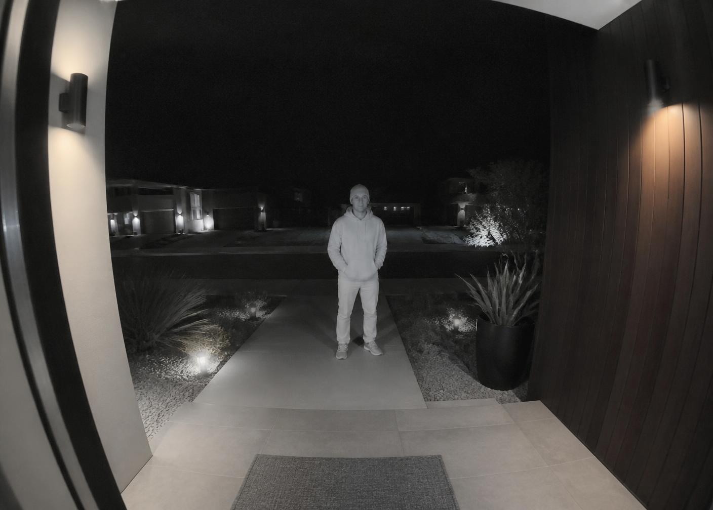 Night vision view of a visitor at 11:47 PM